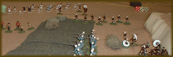 In the background are the advancing rugaruga and Arabs. In the foreground you can see the right flank of the Infanterie de Marine, and some retreating Dabolus.  Not yet revealed is a group of Dabolu spearmen concealed in the cover on the left side of the picture.